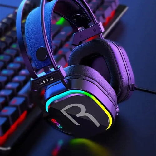 Gaming headset with RGB lighting on a dark surface with keyboard in the background — RGB Illuminations product view